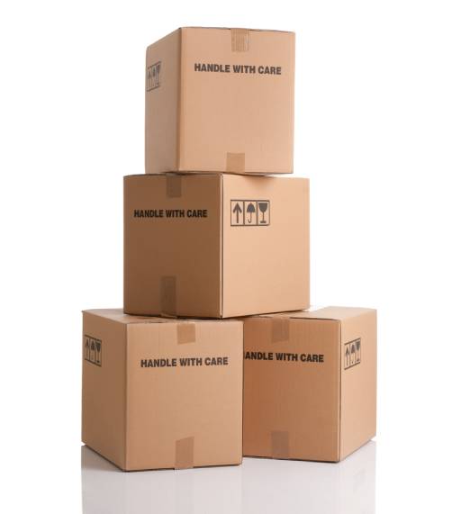 Stacked boxes labeled handle with care